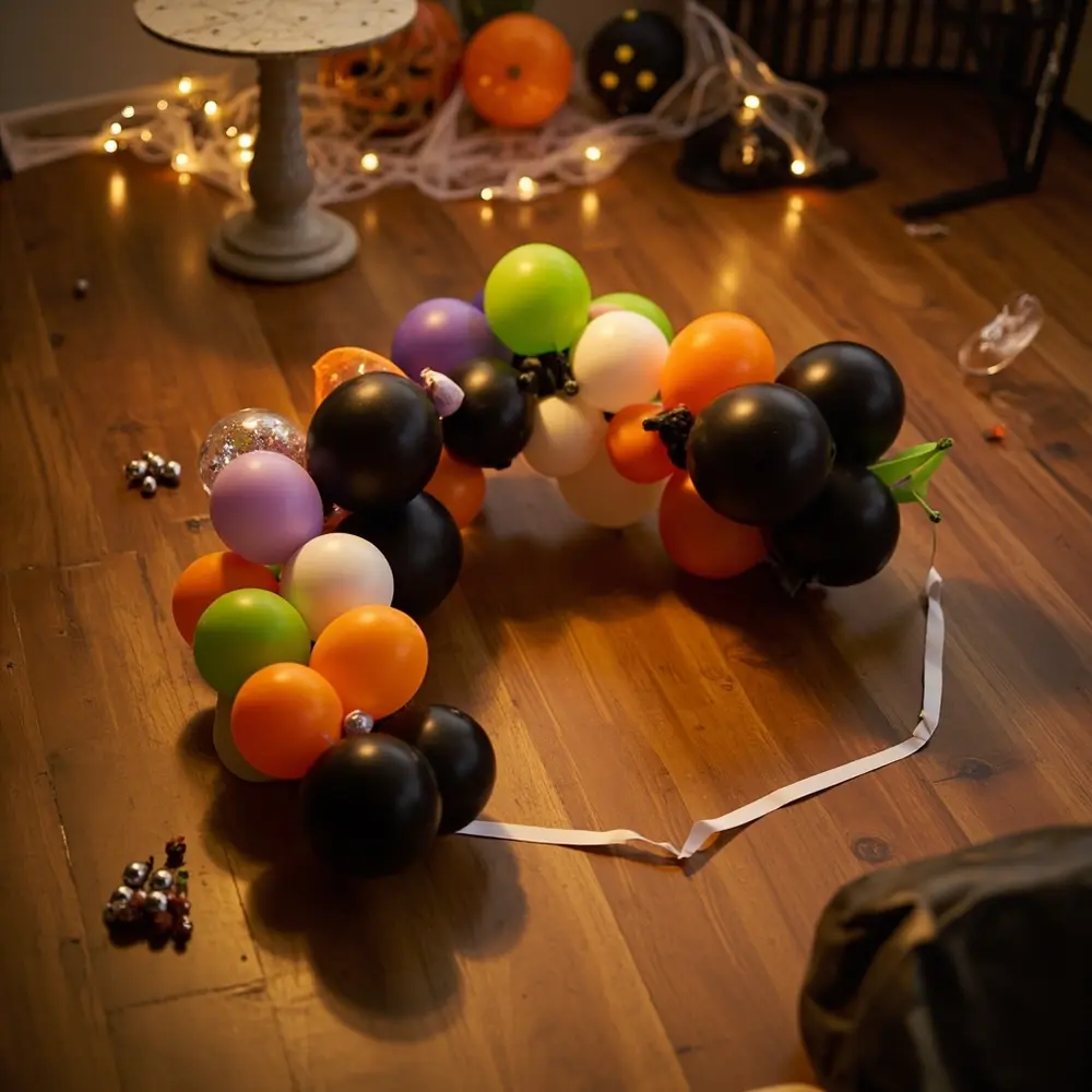 DIY Spooky Halloween Balloon Arch Tutorial: A Ghoulishly Good Party Backdrop 3 Assembled floor arch showing on a balloons strip p onto the em partially image balloon 3 decorating threaded