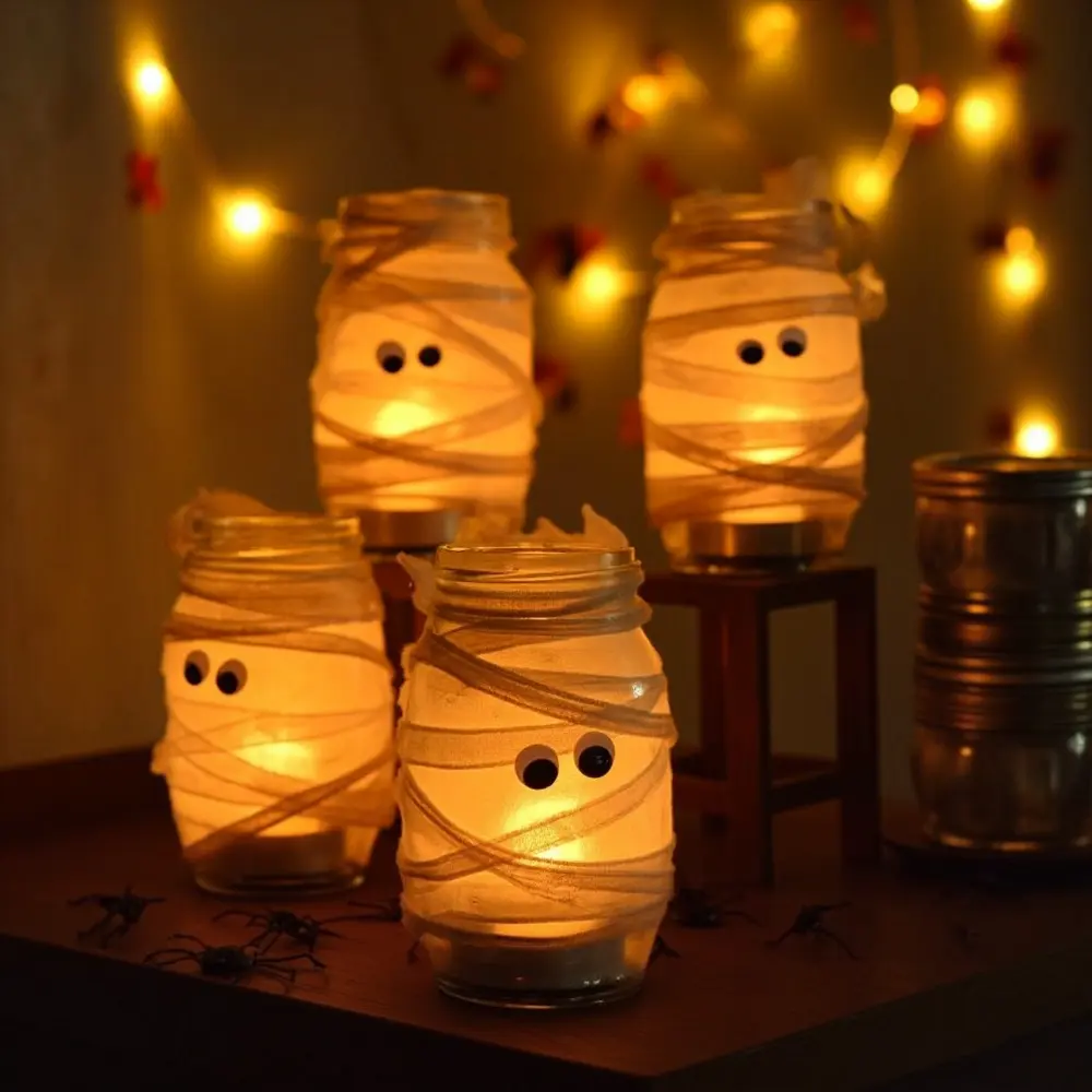 15 Spooktacular & Budget-Friendly Halloween Birthday Decorations (Thrifty Hacks for a Frightfully Fun Party!) 4 Jar h2 luminaries 4 mummy