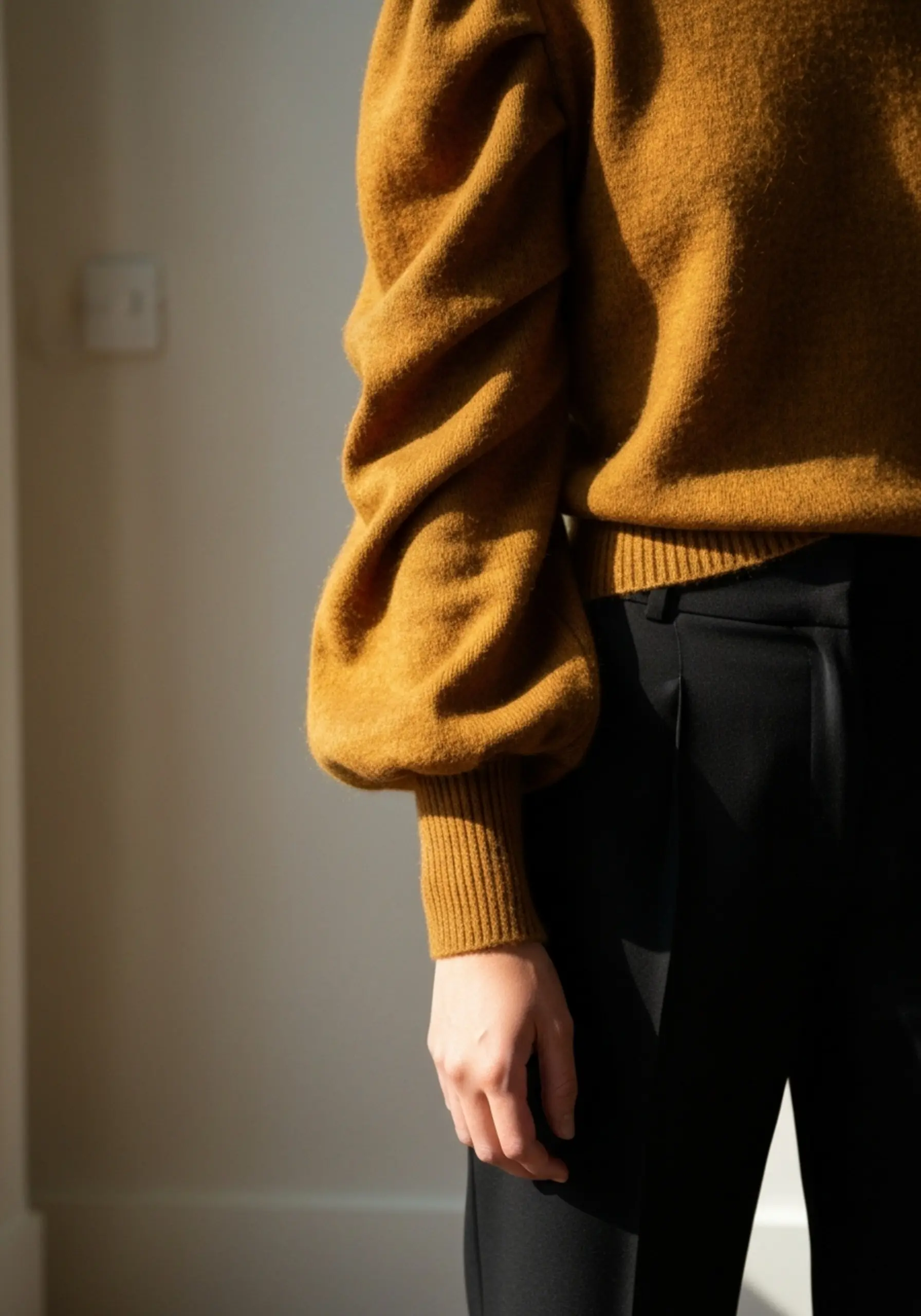 "15 'Casual Chic' Thanksgiving Outfit Ideas (When You're a Guest)" 11 Detail shot dramatic trousers a 11 sleeves simple of black beautiful sweater p paired with image puff