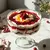 Vibrant white layers a up showcasing of trifle p the shot cream and close cranberry image bowl 2 red