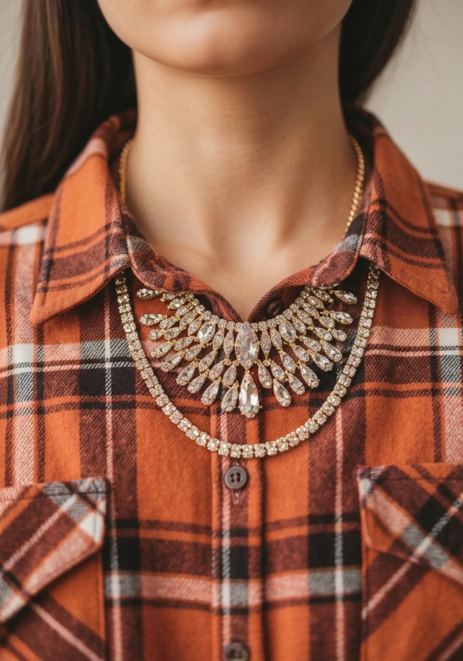 With a up collar of shirt layered p the flannel gold buttoned over close statement image necklace top 6 to sparkling