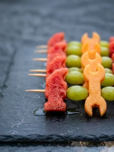Fruit_kabobs_on_slate_board_202605241711_kaveeshmommy_ -
