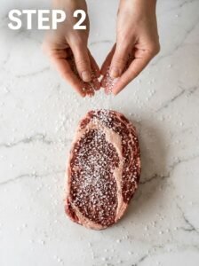 Hands_salting_steak_overhead_202605251148_kaveeshmommy_ -