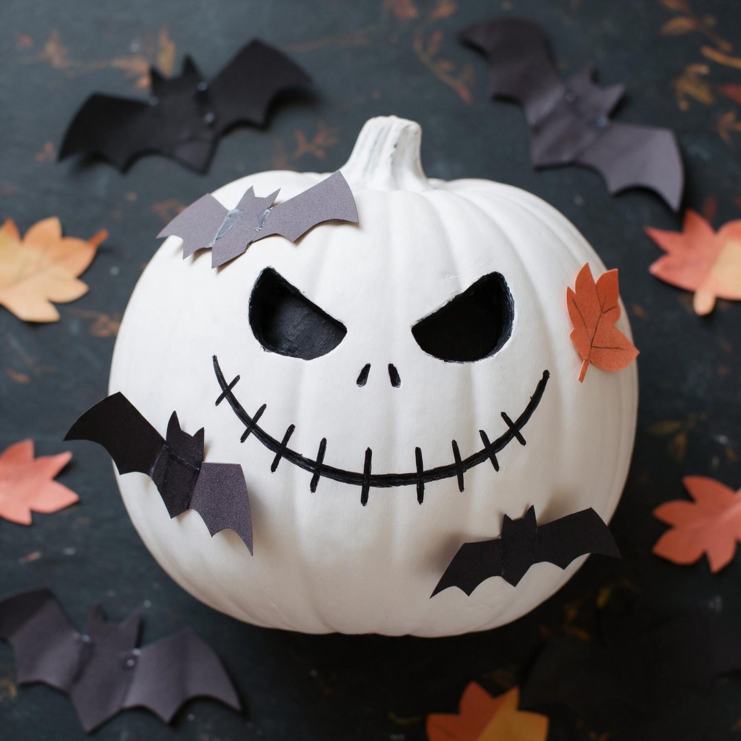 Jack Skellington Nightmare Before Christmas Pumpkin - Smooth white painted pumpkin with crisp black stitched mouth, hollow eyes, and stitched nose lines